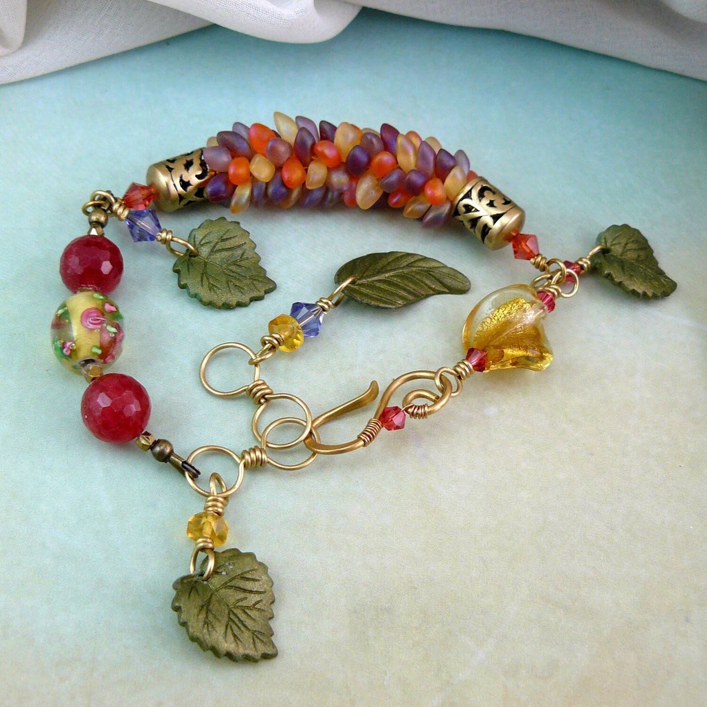 Leafy Dragon Scale Magatama Kumihimo Weave Bead Bracelet with Ruby Quartz